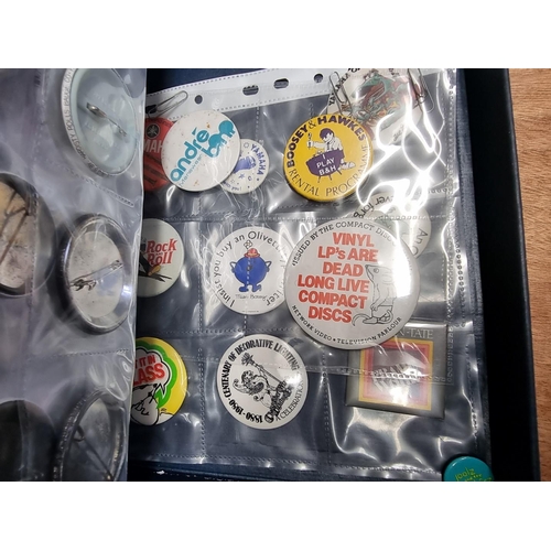 41 - Pin Badges: a small group of various pin badges, some vintage, mainly music related, to include band... 