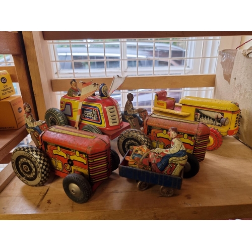 50 - Tinplate: four vintage tinplate tractors; together with other tinplate and diecast vehicles; to incl... 