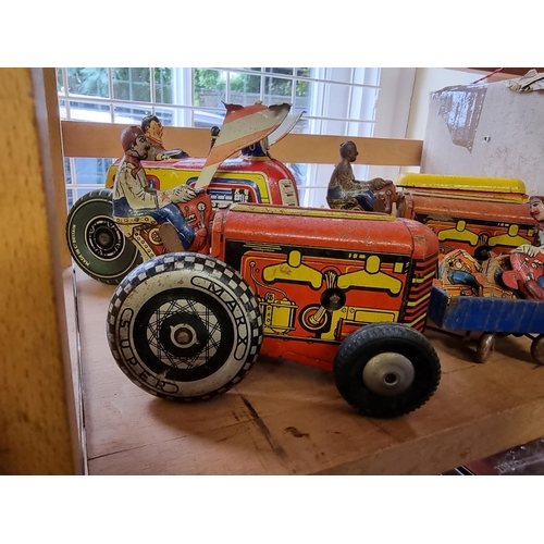 50 - Tinplate: four vintage tinplate tractors; together with other tinplate and diecast vehicles; to incl... 