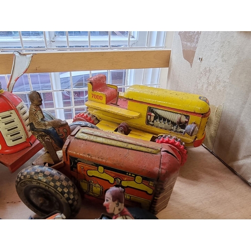 50 - Tinplate: four vintage tinplate tractors; together with other tinplate and diecast vehicles; to incl... 