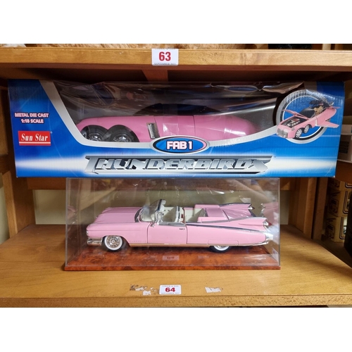 64 - Thunderbirds: a Sun Star diecast model of FAB1, boxed; together with a Maisto pink Cadillac, in disp... 