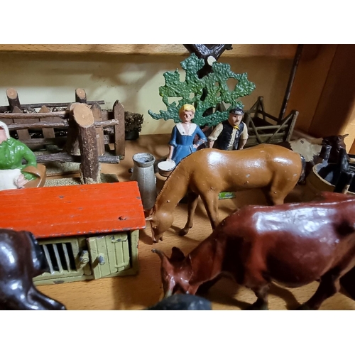 65 - Vintage Lead: a collection of Britains and similar lead farmyard figures and animals, to includ... 