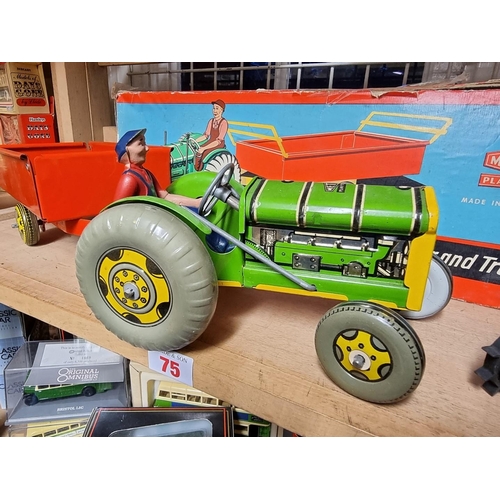 75 - A vintage MAR tinplate tractor; together with a boxed Mettoy tinplate tractor and trailer.... 