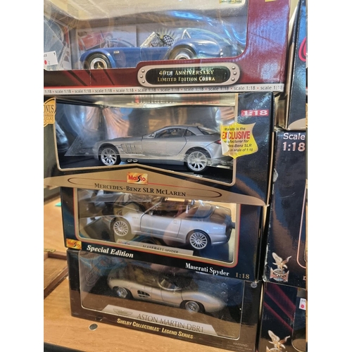 94 - Diecast: three boxed models in the Signature Series, comprising; Shelby Cobra; 1914 Model T fire eng... 