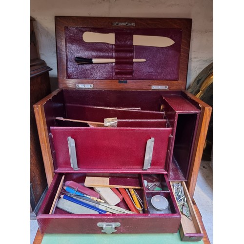 1237 - An early 20th century oak cigar box, 29.5cm wide; together with an oak stationary casket; and anothe... 