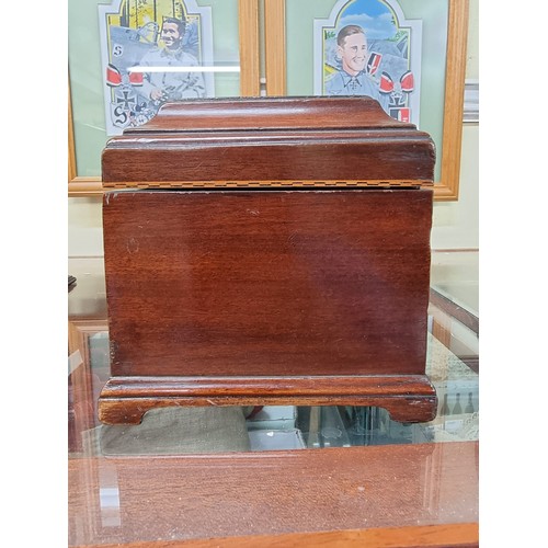 1310 - An early George III mahogany tea caddy, 25.5cm wide. 