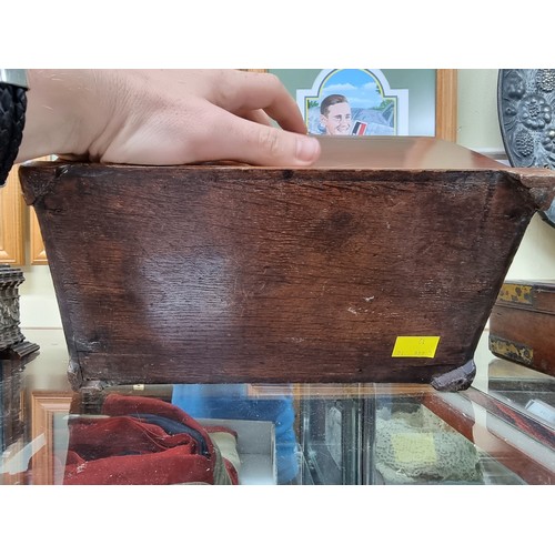 1310 - An early George III mahogany tea caddy, 25.5cm wide. 