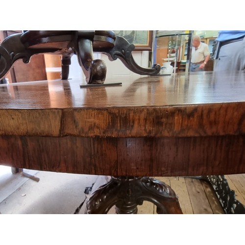 1279 - A mid 19th century rosewood circular tilt top breakfast table, 122cm diameter.