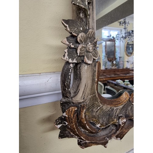 1456 - An 18th century Continental rococo carved and painted wood frame wall mirror, 87 x 44.5cm.... 