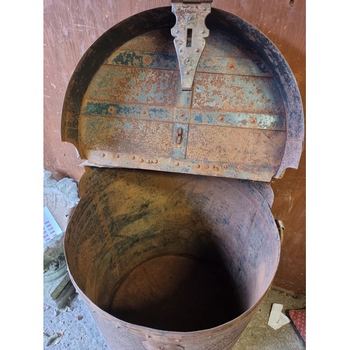 1022 - A large metal animal feed barrel, 65cm wide x 88cm high. 