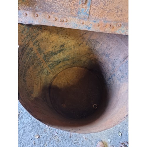 1022 - A large metal animal feed barrel, 65cm wide x 88cm high. 