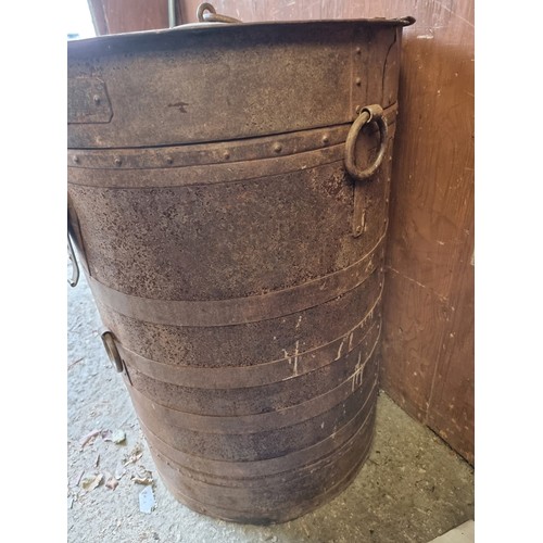 1022 - A large metal animal feed barrel, 65cm wide x 88cm high. 