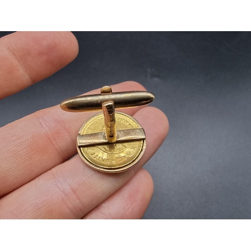 680 - A pair of 9ct gold cufflinks, each set South Africa one rand gold coin, dated 1968/71, gross weight ... 