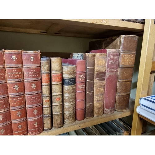 145 - BINDINGS: a quantity of leather bound books over 3 shelves. 