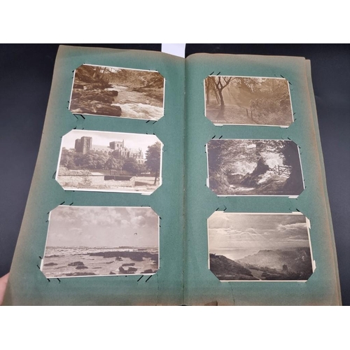 149 - POSTCARD ALBUM: a large format early c20 album, pages full with misc. topographical, comic, historic... 