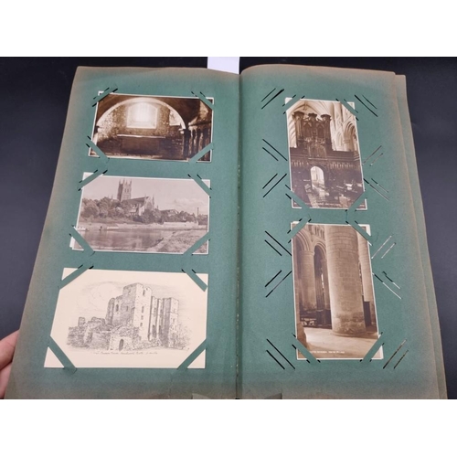 149 - POSTCARD ALBUM: a large format early c20 album, pages full with misc. topographical, comic, historic... 