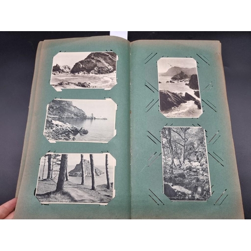 149 - POSTCARD ALBUM: a large format early c20 album, pages full with misc. topographical, comic, historic... 