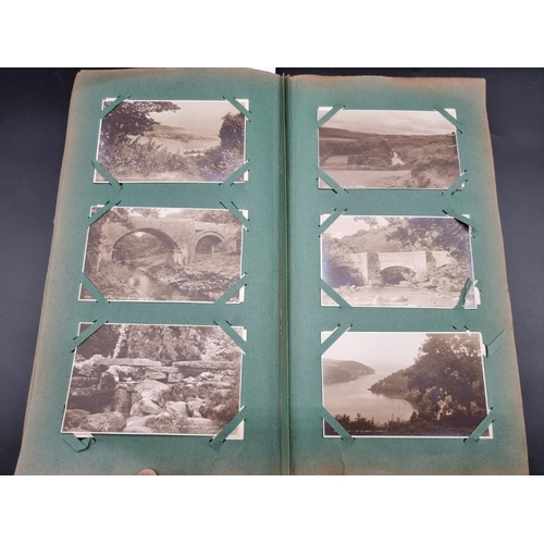 149 - POSTCARD ALBUM: a large format early c20 album, pages full with misc. topographical, comic, historic... 