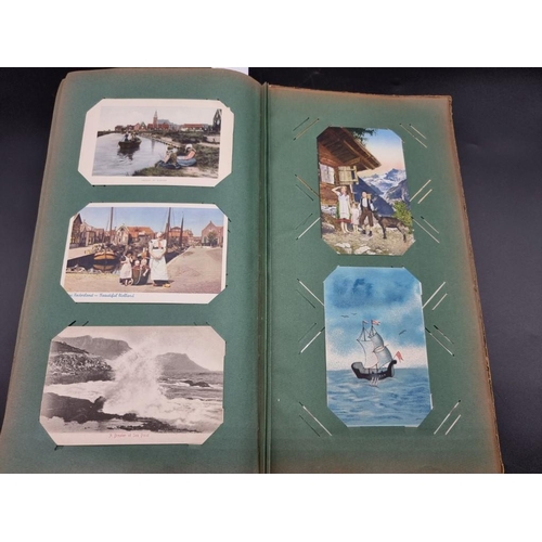 149 - POSTCARD ALBUM: a large format early c20 album, pages full with misc. topographical, comic, historic... 