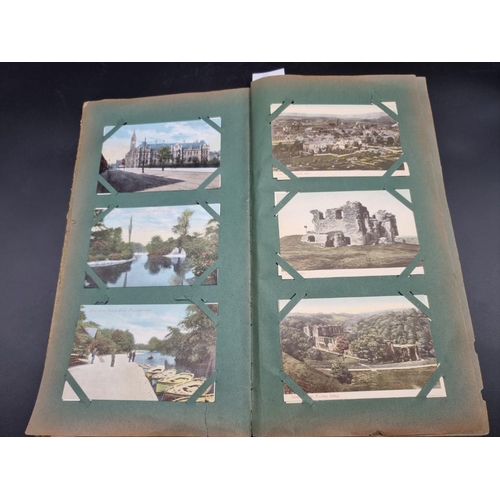 149 - POSTCARD ALBUM: a large format early c20 album, pages full with misc. topographical, comic, historic... 