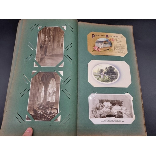 149 - POSTCARD ALBUM: a large format early c20 album, pages full with misc. topographical, comic, historic... 