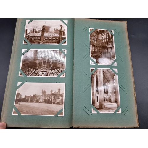 149 - POSTCARD ALBUM: a large format early c20 album, pages full with misc. topographical, comic, historic... 