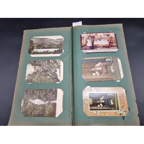 149 - POSTCARD ALBUM: a large format early c20 album, pages full with misc. topographical, comic, historic... 