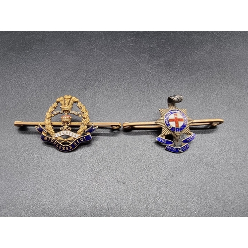 677 - A 'Middlesex Regiment' yellow metal and enamel bar brooch, stamped '15ct', 5.4g gross, 4.9cm wide; t... 