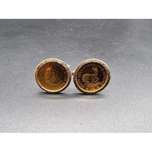 680 - A pair of 9ct gold cufflinks, each set South Africa one rand gold coin, dated 1968/71, gross weight ... 