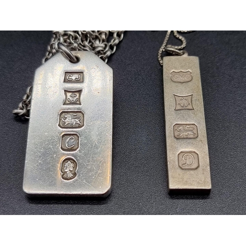 744 - A silver 1oz ingot pendant, together with another 0.5oz example.