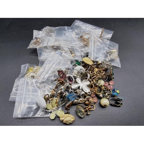 769 - A collection of earrings, some yellow metal; together with other jewellery.