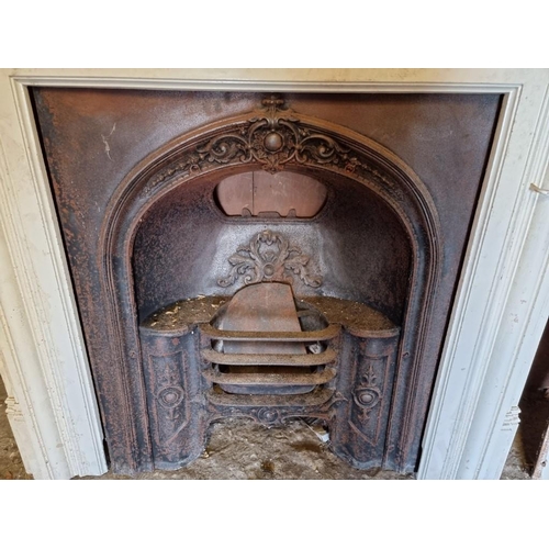 1012 - A cast iron fire surround, 116cm wide x 124cm high; together with a matching fireplace. ... 