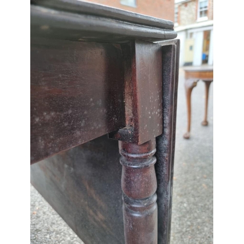 1024 - An antique mahogany dropleaf table, 107cm wide x 72cm high. 