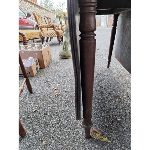 1024 - An antique mahogany dropleaf table, 107cm wide x 72cm high. 