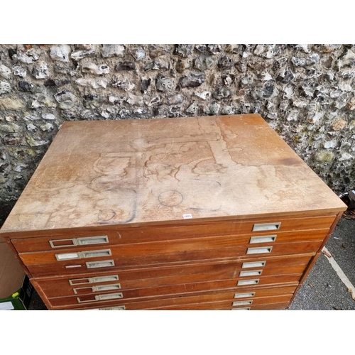 1025 - A nine drawer plan chest, 130cm wide x 93cm deep x 88.5cm high.