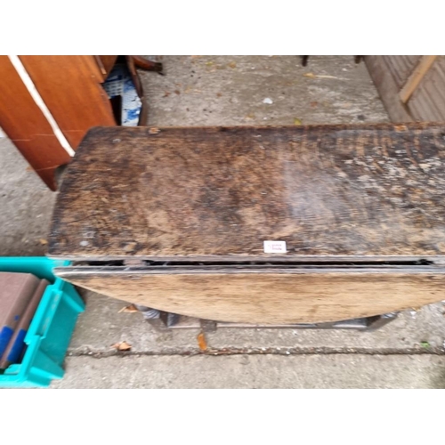 1032 - An 18th century oak gateleg table, 82cm wide x 66cm high, (missing drawer).