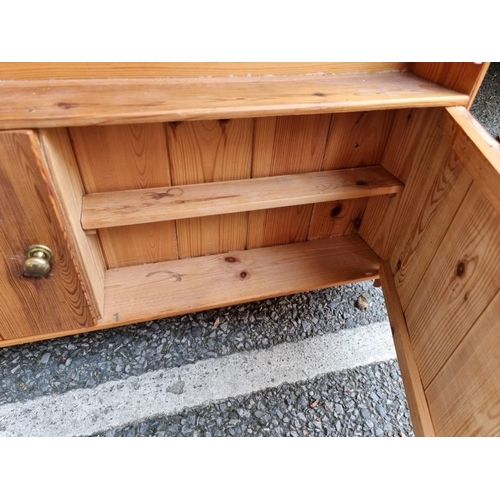 1043 - A small pine hanging wall cupboard, 72cm wide x 75cm high.