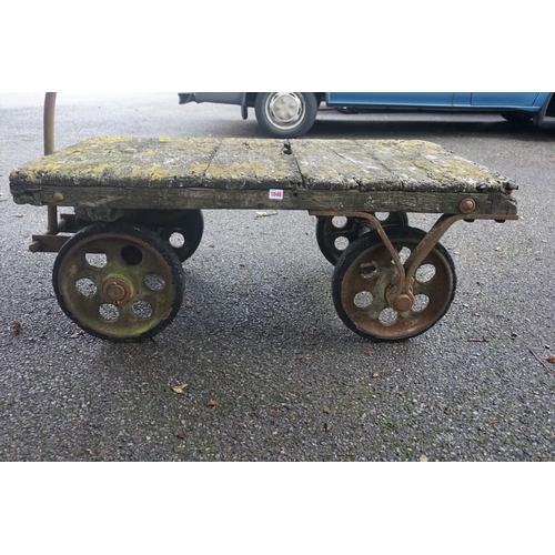 1048 - An antique wooden cart, with iron pull bar, 122cm long x 70cm wide x 47cm high.