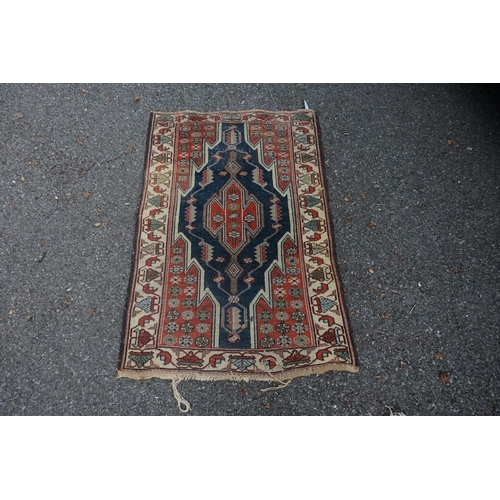 1064 - A Persian rug, having three central crosses to central field, 177 x 97cm; together with a smaller Ha... 