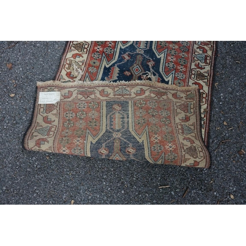 1064 - A Persian rug, having three central crosses to central field, 177 x 97cm; together with a smaller Ha... 