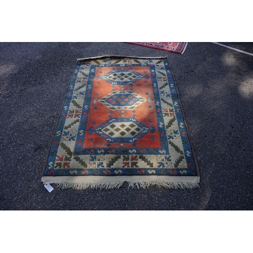 1068 - A Persian rug, having four central medallions, with floral borders, 212 x 130cm; together with anoth... 