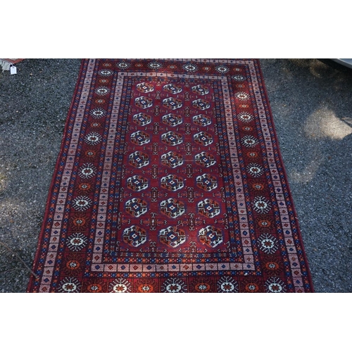 1070 - A Bokhara rug, with repeated design to central field, with geometric borders,  220 x ... 