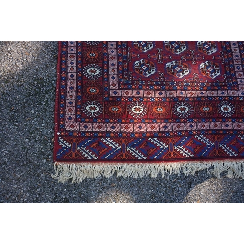 1070 - A Bokhara rug, with repeated design to central field, with geometric borders,  220 x ... 