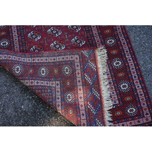 1070 - A Bokhara rug, with repeated design to central field, with geometric borders,  220 x ... 