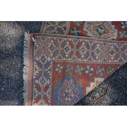 1071 - A Caucasian rug, having five central medallions, 207 x 124cm; together with a smaller example, havin... 