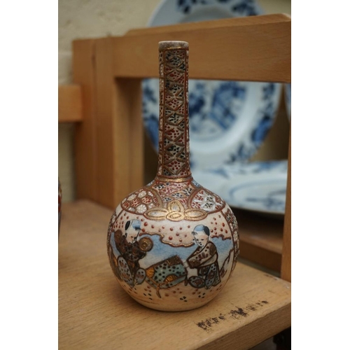 1102 - A collection of Japanese pottery vases, to include a pair with covers, 32.5cm high. (17) ... 