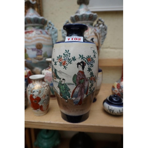 1102 - A collection of Japanese pottery vases, to include a pair with covers, 32.5cm high. (17) ... 