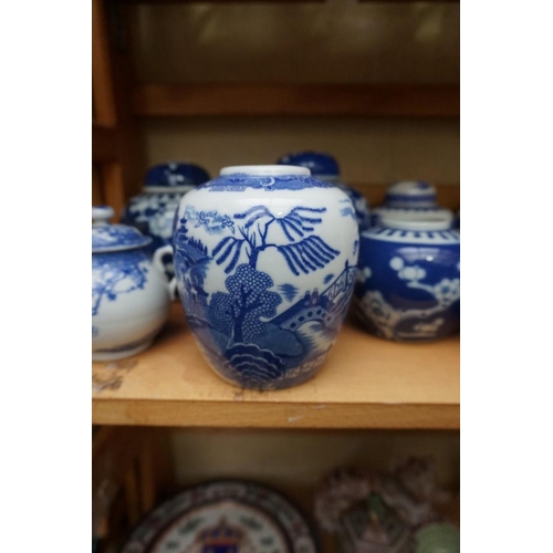 1110 - A collection of Chinese and other blue & white jars and similar, some with covers, largest 15cm ... 