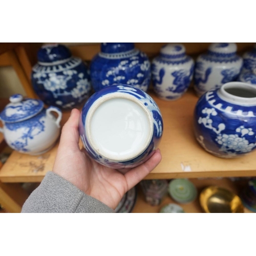 1110 - A collection of Chinese and other blue & white jars and similar, some with covers, largest 15cm ... 