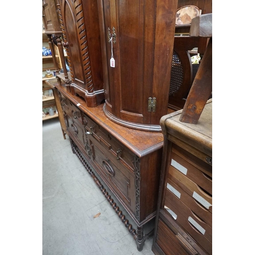 1155 - A 1920s oak dresser base, with cane back, 152cm wide. 